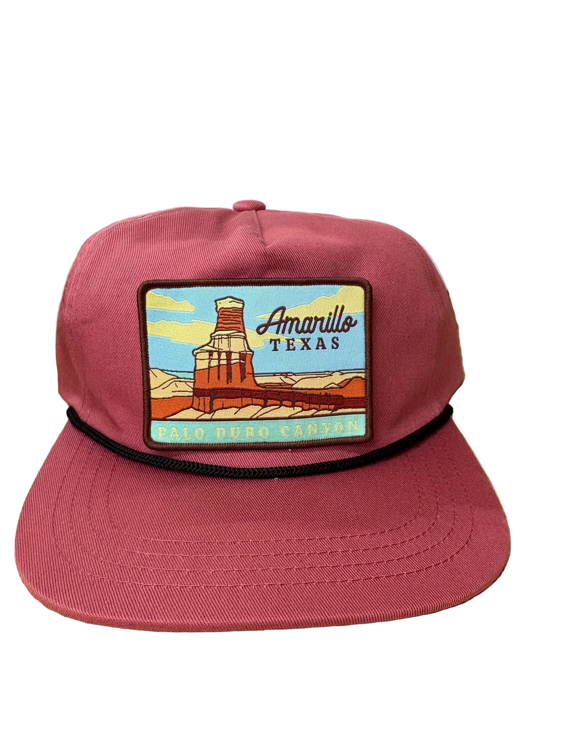 Red cap with a 'Amarillo, Texas' patch on a white background. Patch isn't sewn on in the picture. For display.
